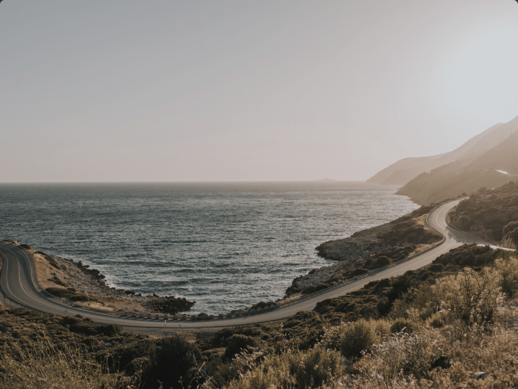 road going through the beautiful california coast line